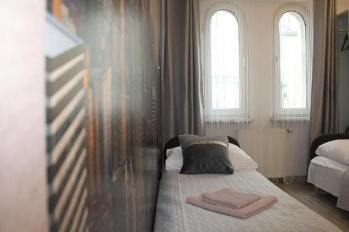 Posteľ alebo postele v izbe v ubytovaní Apartamenty przy Starym Rynku