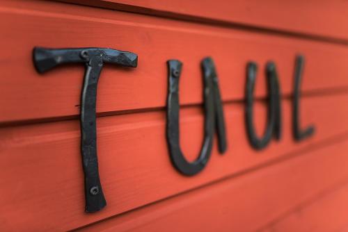 a red dresser with the word truth on it at Kiviranna puhkemajad in Suure-Rakke