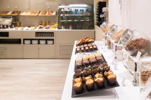 a bakery with several different types of pastries on display at Hotel & Spa Princesa Munia in Oviedo