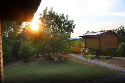 a view of a park with a tree house at Ecolodge Langhe in Cherasco