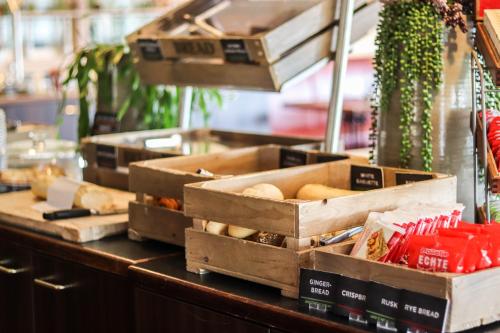 a buffet with boxes of food on a counter at ibis Tilburg in Tilburg