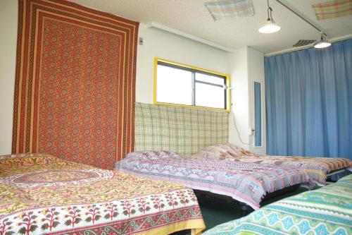 Voodi või voodid majutusasutuse Guest House Japan Heart toas