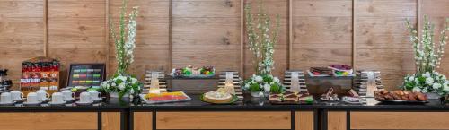 a buffet with food and desserts on a table at Kinar Galilee in Kinar