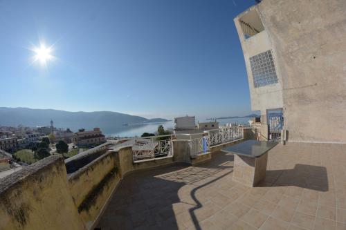 a view of the city from the balcony of a building at Igoumenitsa heart flats to let Mariasroom studios appart seaside-city Spyropoulos in Igoumenitsa