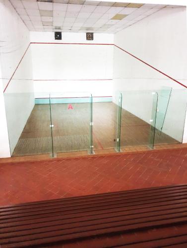 a tennis court with a net in a room at Mahkota Seaview Condo Homestay Near A'Famosa jonker Melaka in Melaka