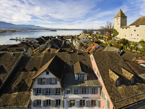 an aerial view of a town with a river and buildings at Sorell Hotel Speer in Rapperswil-Jona