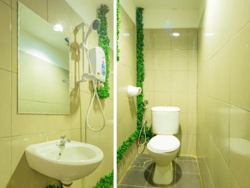 亞庇的住宿－Super OYO 218 Storytel，一间带卫生间和水槽的浴室
