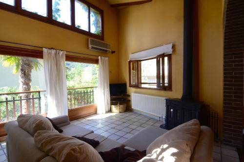 a living room with a couch and a fireplace at CASA TERESA in Albanya