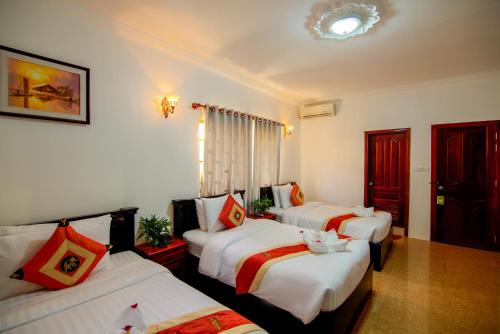 Кровать или кровати в номере Bou Phanith Villa