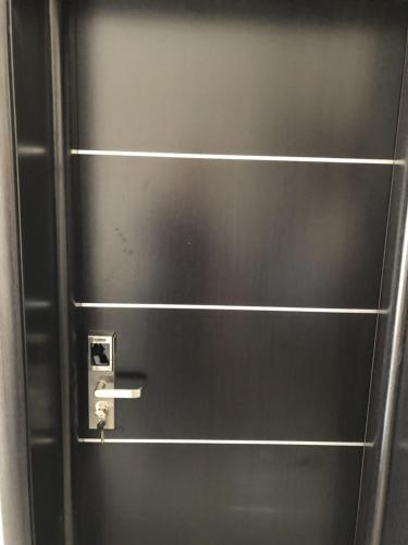 a metal door with a silver handle on it at Villa Anastasia Ksamil in Ksamil