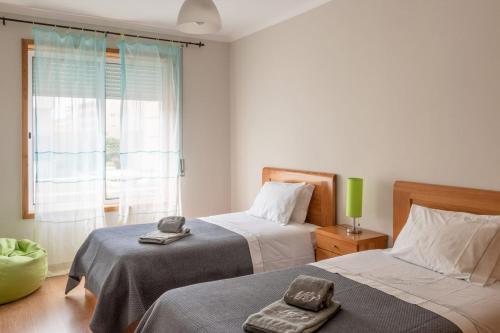 Posteľ alebo postele v izbe v ubytovaní Madalena Beach Apartment by MP