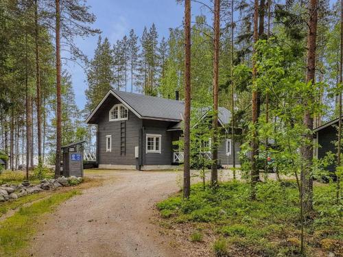 a small house in the middle of a forest at Holiday Home Ahola by Interhome in Kolinkylä
