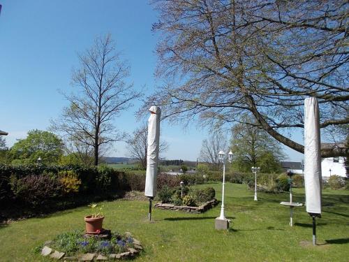 a group of white statues in a park at Hotel Böving in Breckerfeld