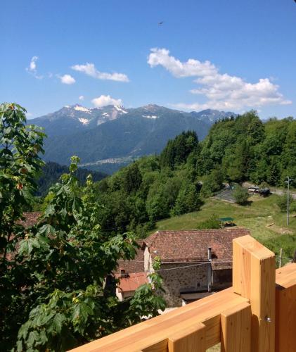 a view of the mountains from the balcony of a house at Albergo Diffuso Ravascletto in Ravascletto