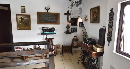 a room with a desk and some items on the wall at Hotel Taco in Bucharest