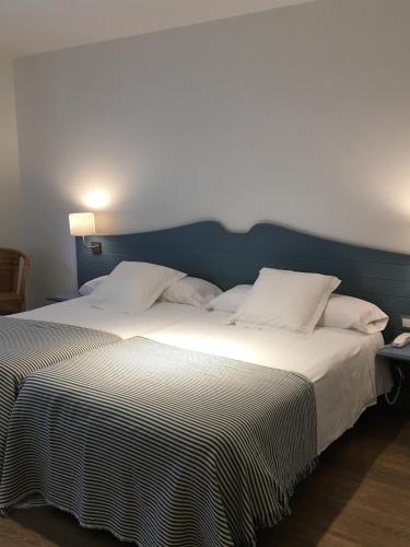 Postel nebo postele na pokoji v ubytování Hotel Valdecoro