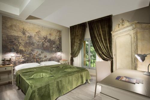 Кровать или кровати в номере Hotel Del Borgo