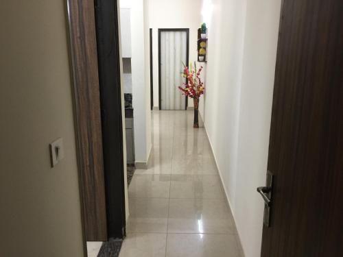 a hallway with a hallwayngthngthngthngthngthngth at The Raveesh E24 - 2BHK Serviced Apartment in New Delhi