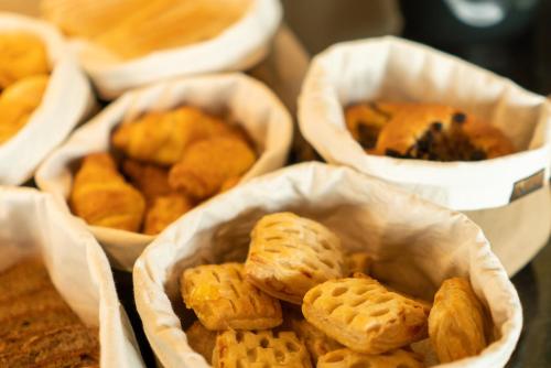 a group of baskets filled with different types of cookies at Focus Hotel Premium Lublin in Lublin