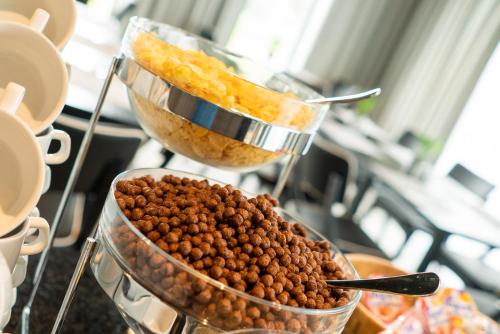 a bunch of food in a bowl on a table at Focus Hotel Premium Lublin in Lublin