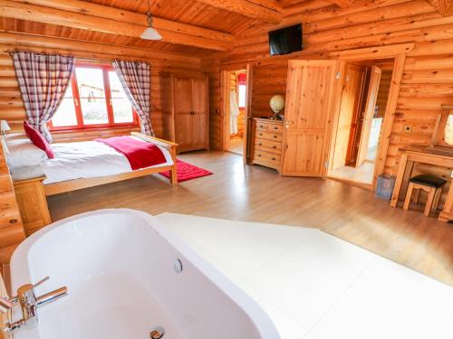 Ένα ή περισσότερα κρεβάτια σε δωμάτιο στο Ash Lodge