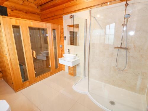 a bathroom with a shower and a sink at Beech Lodge in Oakham