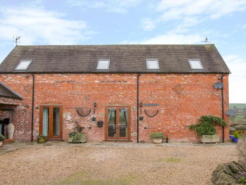 an old red brick house with a roof at Southdown in Much Wenlock
