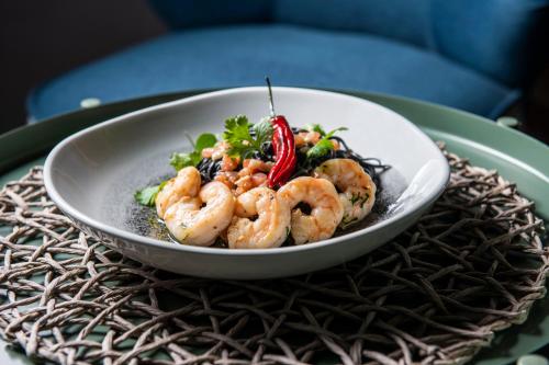 a bowl of shrimp on a plate on a table at Salio Equisport Resort in Stryków