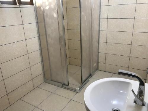 a bathroom with a shower and a sink at Bayraktar Konağı City Center in Demre
