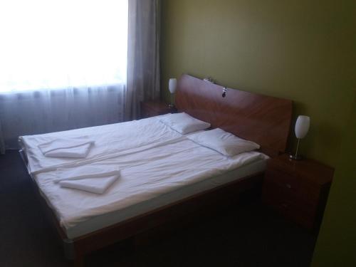 Postel nebo postele na pokoji v ubytování Dzintarjura