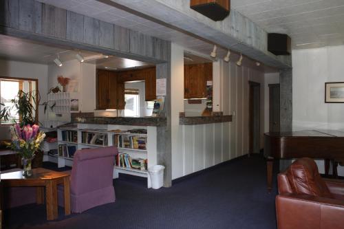 a living room with a couch and a table at St Moritz Lodge and Condominiums in Aspen