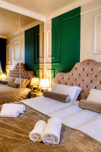 Katil atau katil-katil dalam bilik di Riva Palace - design rooms