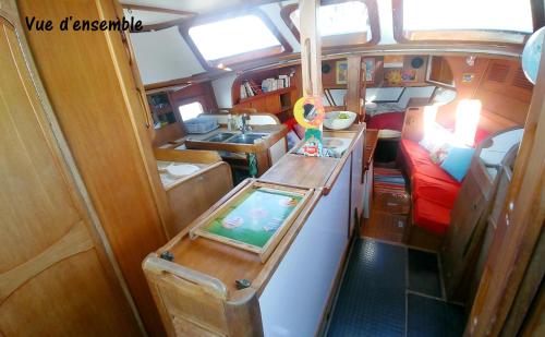 a view of the inside of an rv with a kitchen at Bateau Kyma in Sainte-Anne