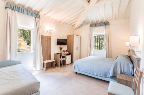 מיטה או מיטות בחדר ב-Agriturismo Fattoria Di Maiano