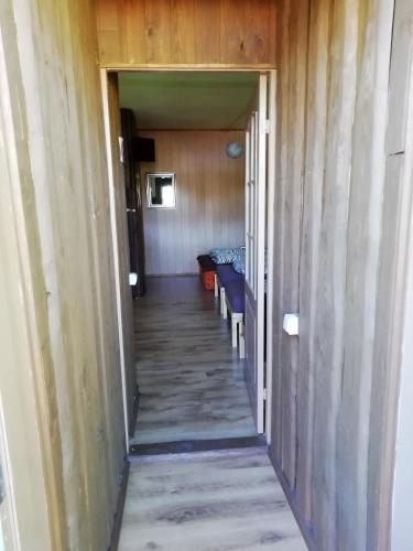 a hallway leading to a room with a table at Atpūtas vieta Buki in Ventspils