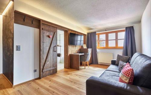 a living room with a couch and a table at Schätzlhof OHG in Ruderting