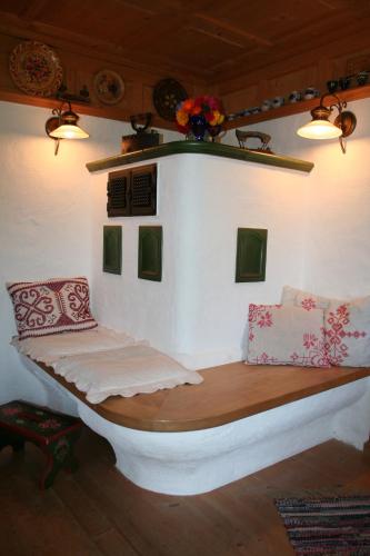 a bed in a room with pillows on it at Haus Schnetzer in Schruns-Tschagguns