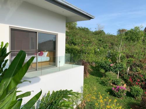 a house with a view of a garden at Villa Bella in Bophut 