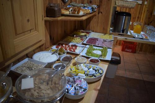 a kitchen counter with a bunch of food on it at Penzion Sabina in Vernár
