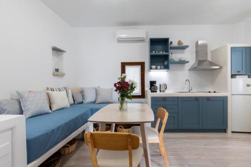 a living room with a couch and a table at Arco Naxos Luxury Apartments in Naxos Chora