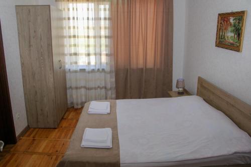 Postel nebo postele na pokoji v ubytování Prometheus Apartment