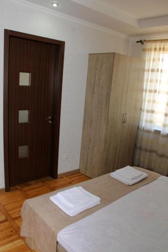 Postel nebo postele na pokoji v ubytování Prometheus Apartment