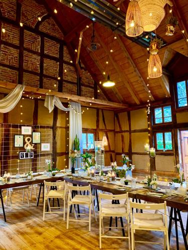 a large room with tables and chairs in it at Landhotel Waldhaus in Laubach