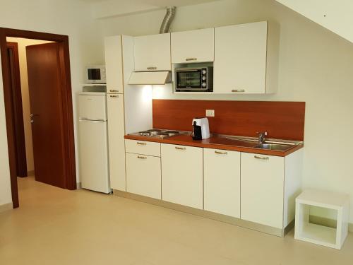 Kuchyň nebo kuchyňský kout v ubytování Residence Ducale