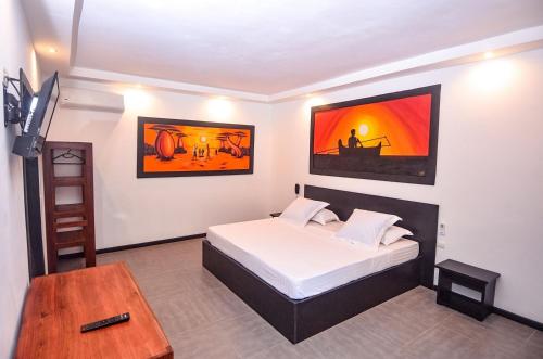 Hotel La Bombonera tesisinde bir odada yatak veya yataklar