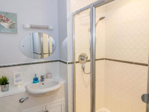 a bathroom with a shower and a sink at 12 Keathbank Court in Blairgowrie