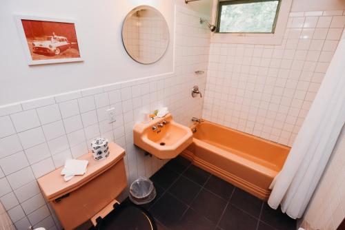 a bathroom with a toilet and a sink and a tub at Rainbow Mountain Resort - LGBTQ Friendly in East Stroudsburg