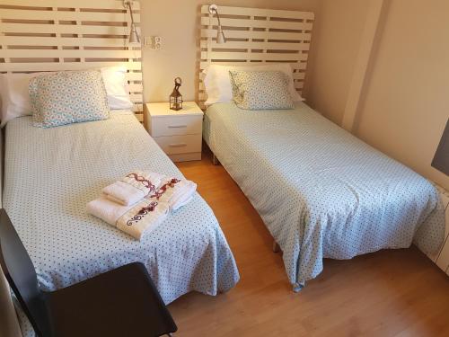 Postel nebo postele na pokoji v ubytování Apartamentos Albero