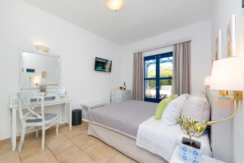 Ένα ή περισσότερα κρεβάτια σε δωμάτιο στο Hotel Mathios