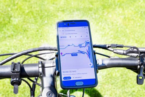 a cell phone on the handlebars of a bike at Casa Bella in Argegno
